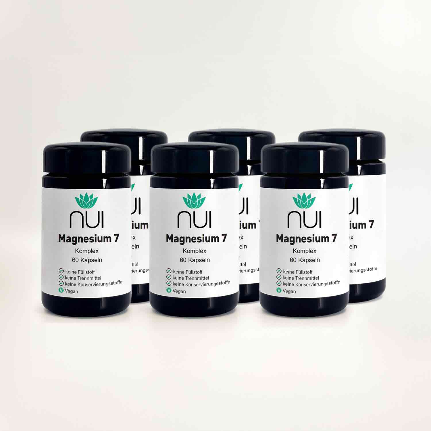 Magnesium 7: sechs Kapselgläser in zwei Reihen vor hellem Hintergrund