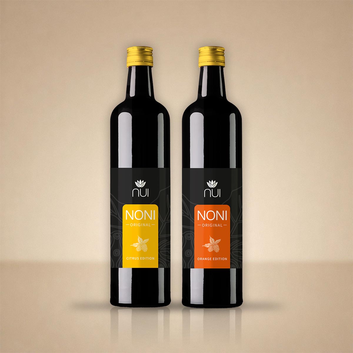 NUI NONI Citrus & Orange Duo: zwei Flaschen mit gelbem und orangefarbenem Etikett nebeneinander